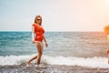 Happy loving family mother and daughter having fun together on the beach. Mum playing with her kid in holiday vacation Royalty Free Stock Photo