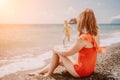 Happy loving family mother and daughter having fun together on the beach. Mum playing with her kid in holiday vacation Royalty Free Stock Photo