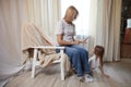 Happy loving family with mother and daughter in living room. Woman mom and small child girl playing and having Royalty Free Stock Photo