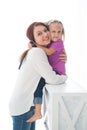 Happy loving family. Mother and her daughter child girl playing and hugging Royalty Free Stock Photo