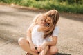 Happy loving family. Mother and her daughter child girl playing and hugging. alley of big trees. close up view Royalty Free Stock Photo