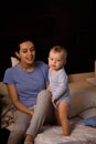 Happy loving family. Mother playing with her baby in the bedroom.