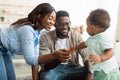 Portrait of happy black family smiling playing at home Royalty Free Stock Photo