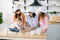 Happy loving family are preparing bakery together. Grandmother, two daughters and child granddaughter girl are baking Royalty Free Stock Photo