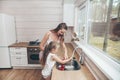 Happy loving family preparing food together. Smiling Mom and child daughter girl washing fruits and vegetables and having fun in Royalty Free Stock Photo