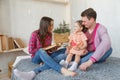 Happy loving family. pretty young mother reading a book to her daughter Royalty Free Stock Photo