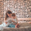 Happy loving family. Pretty young mother reading a book to her little son Royalty Free Stock Photo