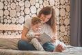 Happy loving family. Pretty young mother reading a book to her little son Royalty Free Stock Photo