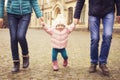 Happy loving family(mother, father and little daughter kid) outdoors walking having fun on a park in autumn season. Fallen yellow Royalty Free Stock Photo