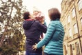 Happy loving family(mother, father and little daughter kid) outdoors walking having fun on a park in autumn season. Fallen yellow Royalty Free Stock Photo