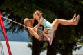 Happy loving family! Young mother and her child daughter swinging on the swings and laughing a summer evening outdoors, beautiful Royalty Free Stock Photo