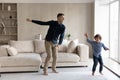 Happy loving father with little son dancing in living room Royalty Free Stock Photo