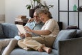 Happy middle aged 60s family couple using digital computer tablet. Royalty Free Stock Photo