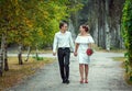 Happy loving wedding couple walking in the autumn park Royalty Free Stock Photo