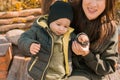 Happy loving young mother having fun with her toddler son on the walk Royalty Free Stock Photo