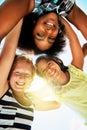 Happy, low angle and portrait of kids in summer for friendship, playing and fun together. Diversity, youth and girls Royalty Free Stock Photo