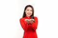 Happy lunar new year. Asian woman wearing traditional ao dai clothes portrait on white wall