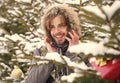 Happy macho with bearded face in snow forest