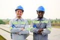 Happy maintenance engineers checking and maintaining solar panels Royalty Free Stock Photo