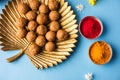 Happy Makar Sankranti - indian festival and tilgul with kite or patang and reel / fikri or spool with haldi kumkum Royalty Free Stock Photo