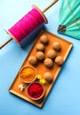 Happy Makar Sankranti - indian festival and tilgul with kite or patang and reel / fikri or spool with haldi kumkum Royalty Free Stock Photo