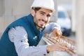 happy male builder working on metal structure Royalty Free Stock Photo