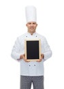 Happy male chef cook holding blank menu board Royalty Free Stock Photo
