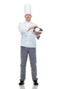 Happy male chef cook holding cloche