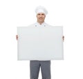 Happy male chef cook holding white blank big board Royalty Free Stock Photo