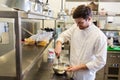 Happy male chef cooking food at restaurant kitchen Royalty Free Stock Photo