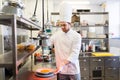 Happy male chef cooking food at restaurant kitchen Royalty Free Stock Photo