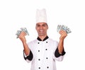 Happy male in cook uniform holding money