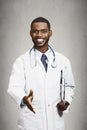 Happy male doctor giving handshake to his patient Royalty Free Stock Photo