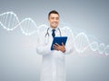 Happy male doctor with tablet pc and dna molecule Royalty Free Stock Photo