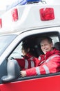 happy male and female paramedics sitting Royalty Free Stock Photo