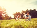 Male and female playing with children outside Royalty Free Stock Photo