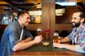 Happy male friends drinking beer at bar or pub Royalty Free Stock Photo