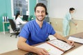 Happy male hospital receptionist looking at camera Royalty Free Stock Photo