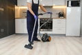 Happy Male Janitor Cleaning Carpet With Vacuum Cleaner Royalty Free Stock Photo