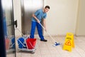 Male Janitor Mopping Floor Royalty Free Stock Photo