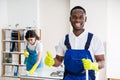 Happy Male Janitor In Office