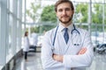 Happy male medical doctor portrait in hospital.