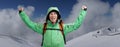 Happy male mountaineer man with raised arms. In background high mountains above clouds . Royalty Free Stock Photo