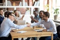 Happy partners shake hands get team applause after successful negotiations Royalty Free Stock Photo