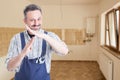 Happy male plumber doing timeout gesture Royalty Free Stock Photo