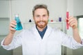 happy male scientist holding flask and test-tube Royalty Free Stock Photo