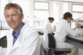 Happy Male Scientist In Laboratory