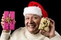 Happy Male Senior Showing Two Wrapped Presents Royalty Free Stock Photo
