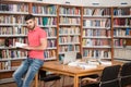 Happy Male Student With Book In Library Royalty Free Stock Photo