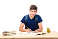 Happy male student sitting at the table Royalty Free Stock Photo